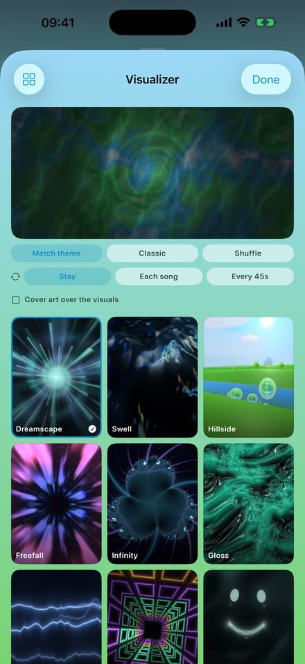 The visualizer picker: a live preview panel at the top, rows of options reading Match theme, Classic and Shuffle, then Stay, Each song and Every 45s, a checkbox for cover art over the visuals, and a grid of named scene tiles including Dreamscape, Swell, Hillside, Freefall, Infinity and Gloss.